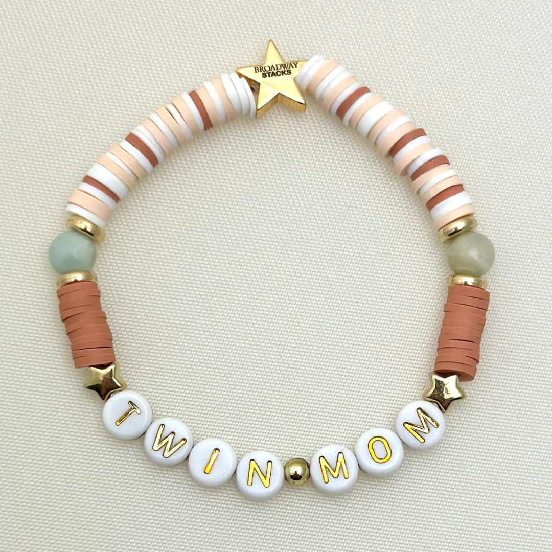Broadway Stacks Motherlode Special Edition bracelets. Stretch bracelets. Greens, browns, white and gold colored beads. Letter beads that spell Motherlode, Boy Mom, Girl Mom, Twin Mom,
