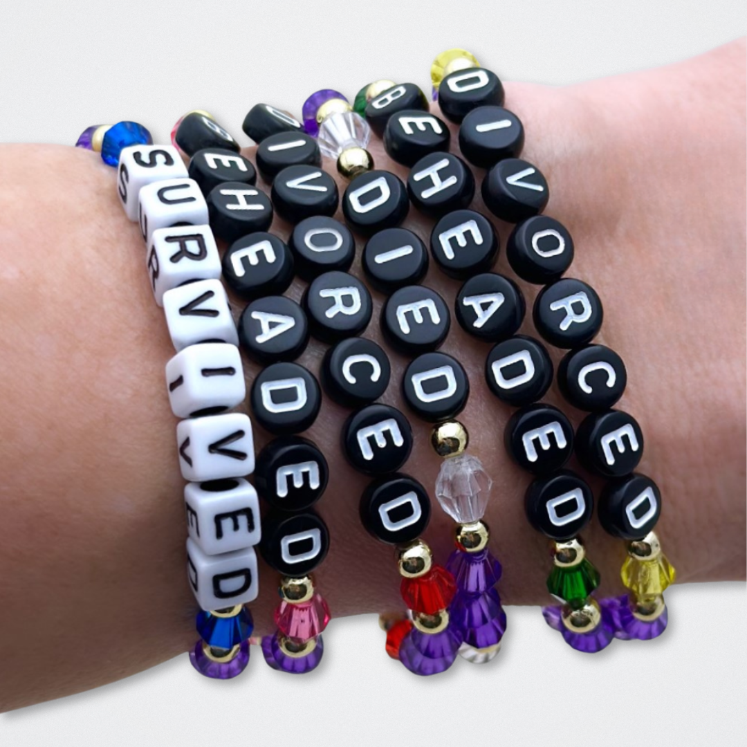 Broadway Stacks QUEEN collection. Stretch bracelets included in Stack. Gold, yellow, green, white, red, pink and blue colored beads. Letter beads that spell each queen. Also Herstory collection. Broadway Stacks gold star logo bead to remind you that You Shine. SIX the Musical fans.