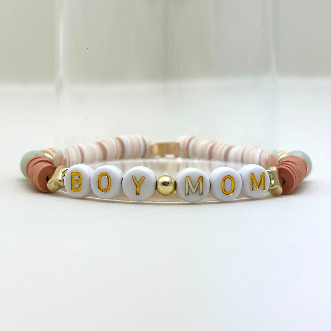 Broadway Stacks Motherlode Special Edition bracelets. Stretch bracelets. Greens, browns, white and gold colored beads. Letter beads that spell Motherlode, Boy Mom, Girl Mom, Twin Mom,