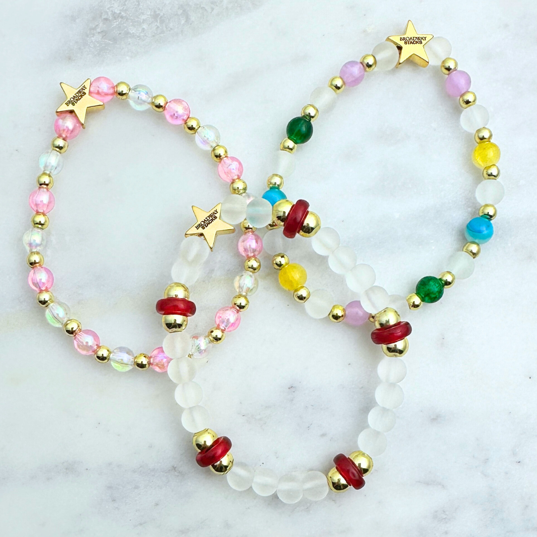 Broadway Stacks STAY GOLD collection. Stretch bracelets included in Stack. Inspired by characters from The Outsiders. Broadway Stacks gold star logo bead on back.