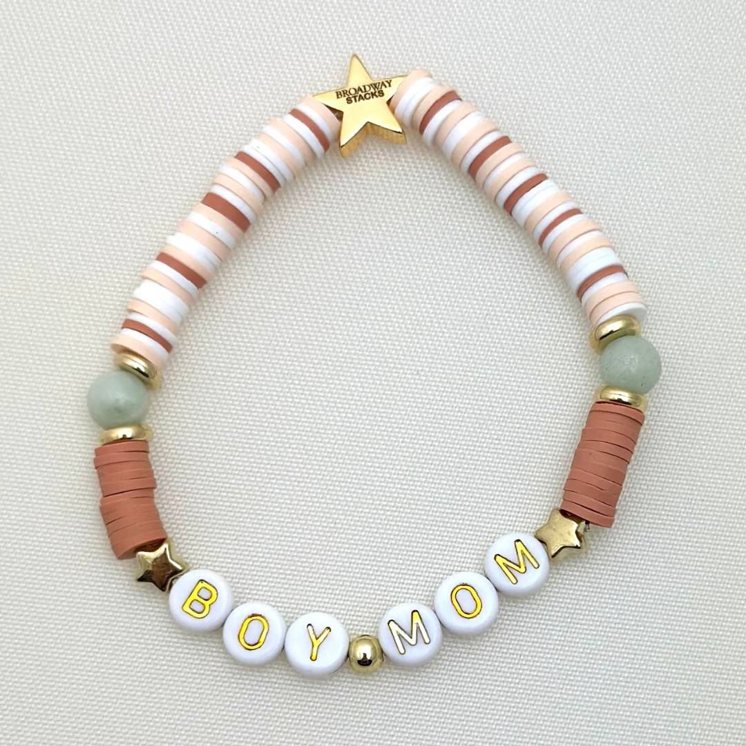 Broadway Stacks Motherlode Special Edition bracelets. Stretch bracelets. Greens, browns, white and gold colored beads. Letter beads that spell Motherlode, Boy Mom, Girl Mom, Twin Mom,