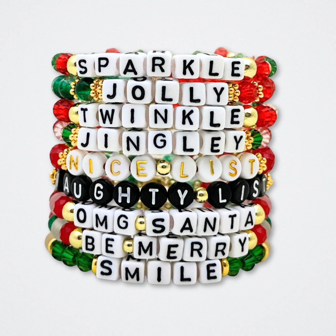 Broadway Stacks CHRISTMAS ELF Collection. Coordinating bead bracelets included in Stack. Red, green, white and gold colored beads. Letter beads that spell quotes. Gold star logo bead to remind you that you shine. Elf the Musical and Christmas holiday fans.