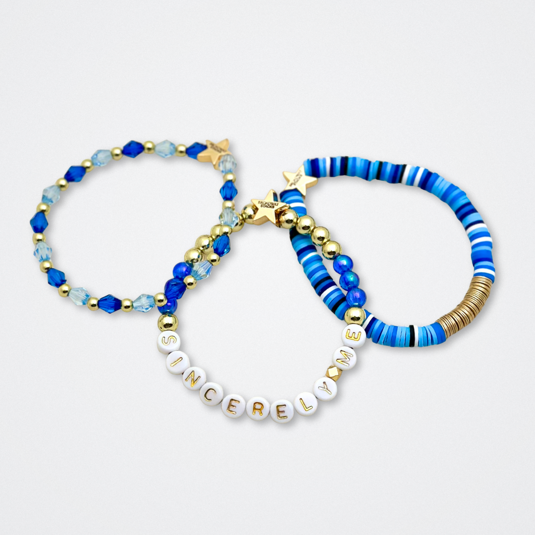 Broadway Stacks SKY collection. 3 stretch bracelets included in Stack. Blues, white, black and gold colored beads. Letter beads that spell quotes. Gold star logo bead to remind you that You Shine. Dear Evan Hansen DEH fans.