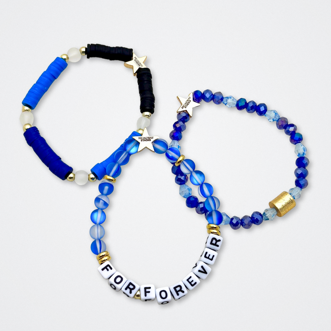 Broadway Stacks SKY collection. 3 stretch bracelets included in Stack. Blues, white, black and gold colored beads. Letter beads that spell quotes. Gold star logo bead to remind you that You Shine. Dear Evan Hansen DEH fans.