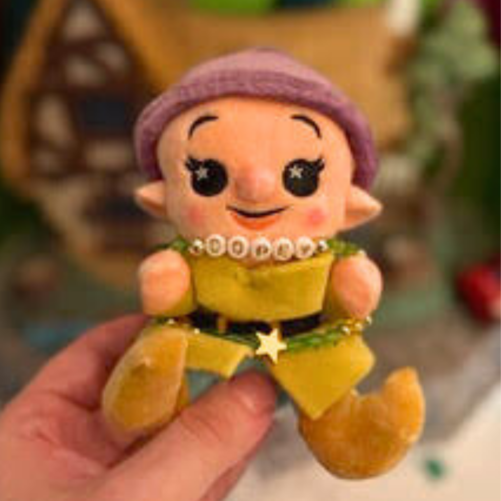 Broadway Stacks Special Edition bracelet. Green, yellow, purple and gold beads. Letter beads that spell Dopey. A portion of the proceeds go to Gilana's Fund. Gold star logo bead to remind you that you shine.