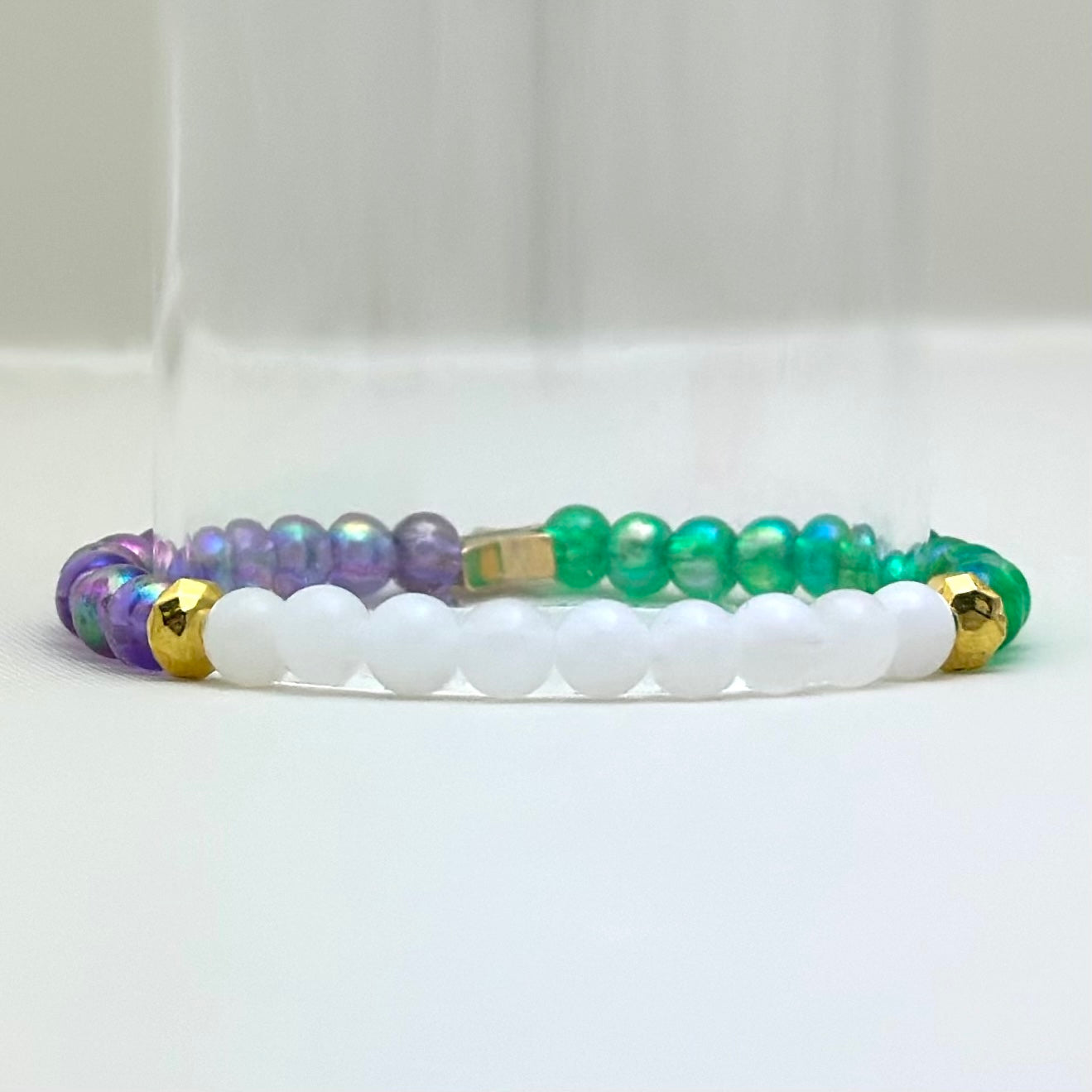 Broadway Stacks PRIDE collection. Avaliable in 8 designs. Red, orange, yellow, green, blue, purple, pink, white, grey, black and gold colored beads. Broadway Stacks gold star logo bead on back.