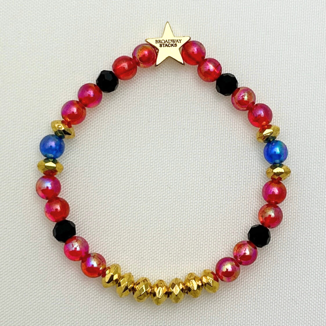 Broadway Stacks JAZZY Collection. 5 stretch bracelets included in Stack. Red, blue, black and gold colored beads. Letter beads that spell quotes. Gold star logo bead to remind you that you shine.