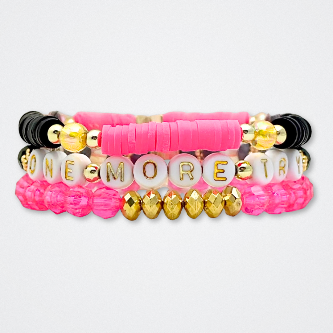 Broadway Stacks De Bois Band collection. 3 stretch bracelets included in Stack. Pinks, golds and black colored beads. Letter beads that spell quotes. Broadway Stacks gold star logo bead to remind you that you shine. & Juliet fans.