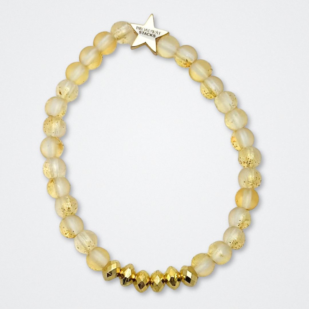 Broadway Stacks De Bois Band collection. 3 stretch bracelets included in Stack. Pinks, golds and black colored beads. Letter beads that spell quotes. Broadway Stacks gold star logo bead to remind you that you shine. & Juliet fans.