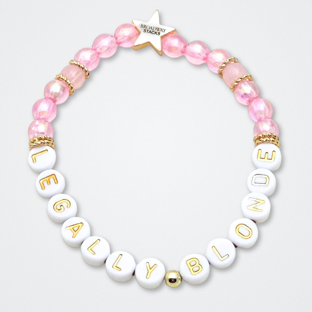 Broadway Stacks KEEP IT POSITIVE Collection. 9 stretch bracelets included in Stack. Pinks, white and gold colored beads. Letter beads that spell quotes. Gold star logo bead to remind you that you shine. Legally Blonde fans.