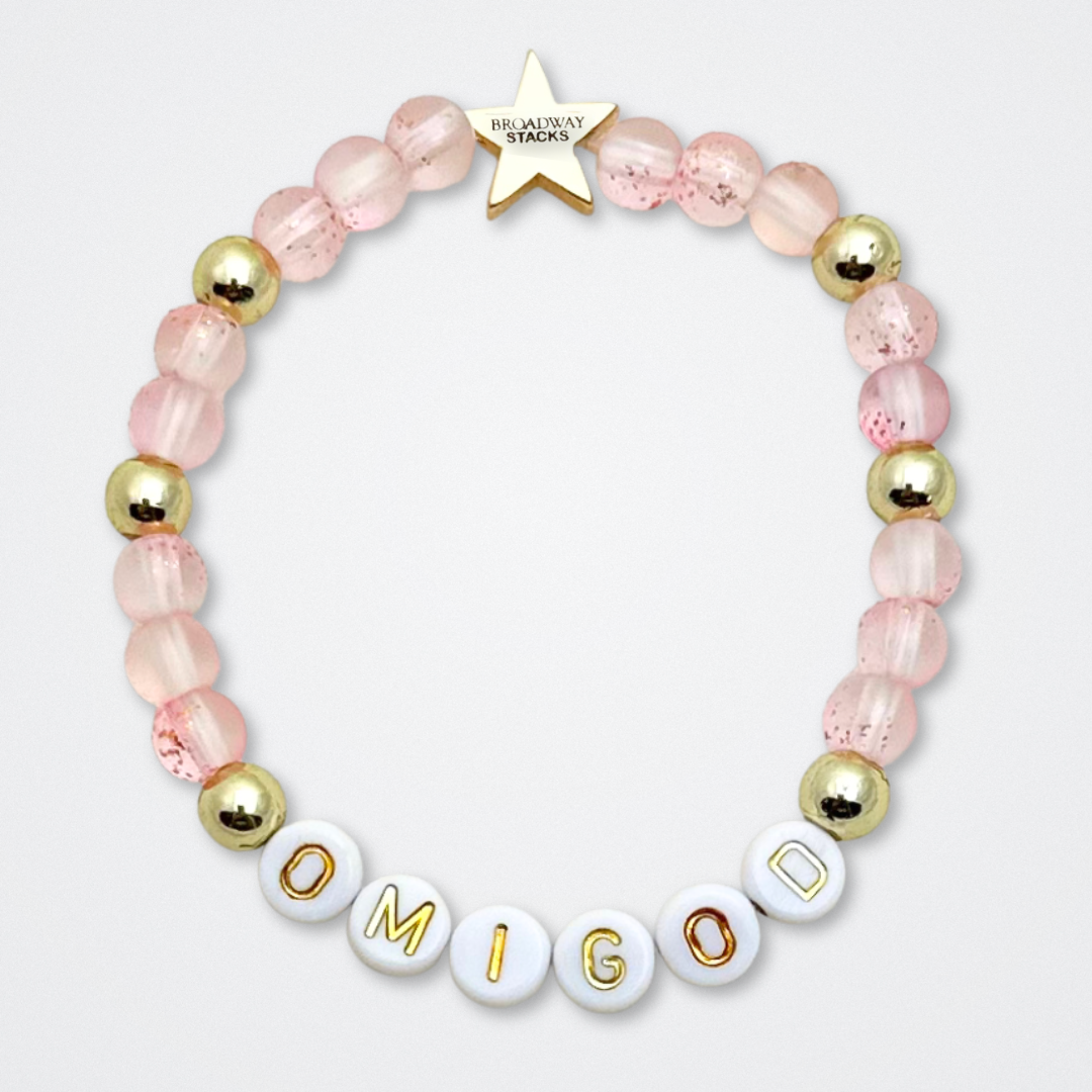 Broadway Stacks KEEP IT POSITIVE Collection. 9 stretch bracelets included in Stack. Pinks, white and gold colored beads. Letter beads that spell quotes. Gold star logo bead to remind you that you shine. Legally Blonde fans.