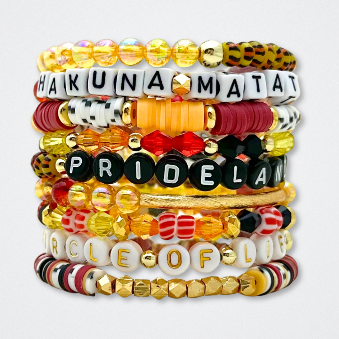 Broadway Stacks SAFARI collection. 3 stretch bracelets included in Stack. Dark reds, yellow, orange, white, black and gold colored beads. Animal print beads as well. Letter beads that spell quotes, Gold star logo bead to remind you that you shine.