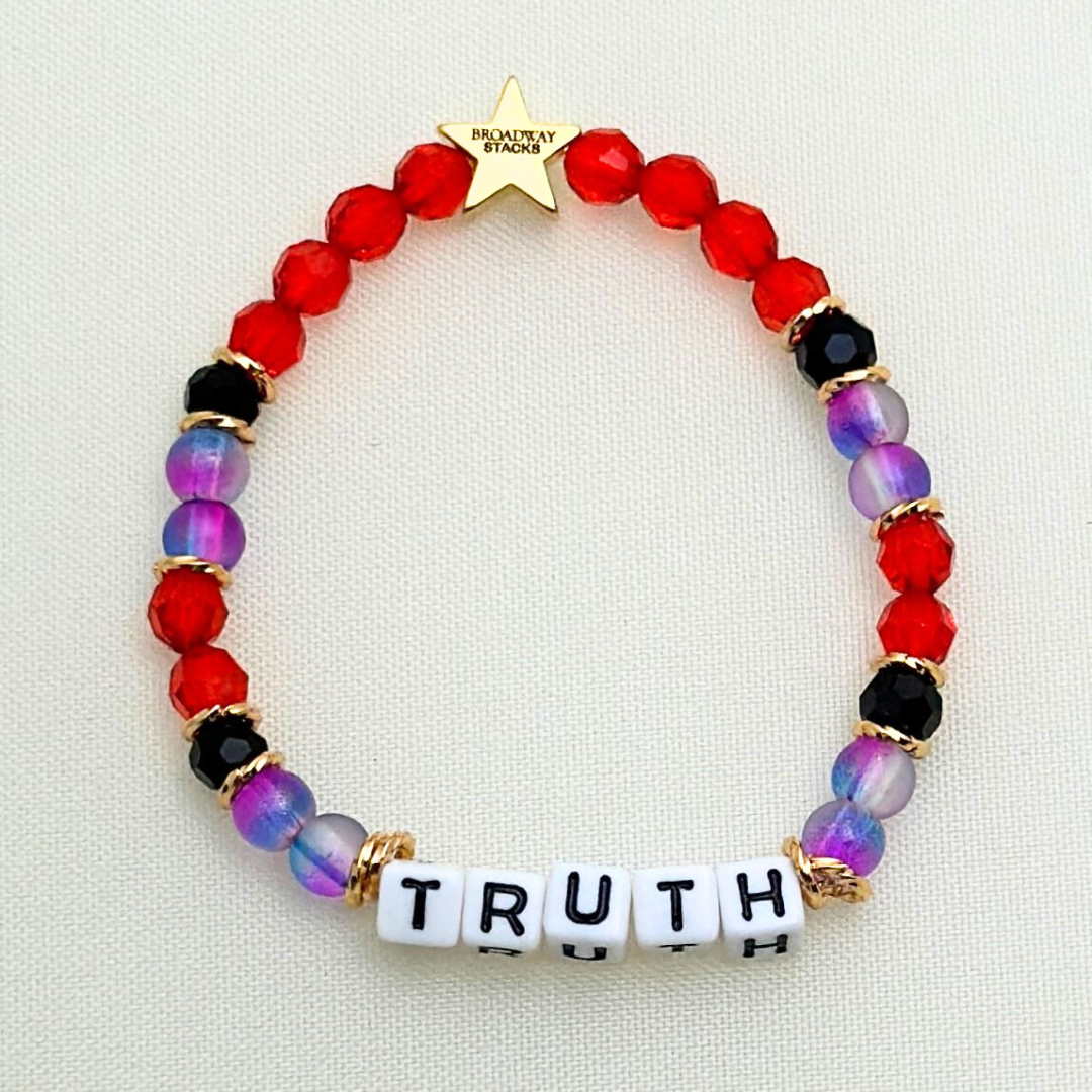 Broadway Stacks RED LIGHT Collection. 5 stretch bracelets included in Stack. Red, purple, black and gold colored beads. Letter beads that spell quotes. Gold star logo bead to remind you that you shine. Moulin Rouge fans.