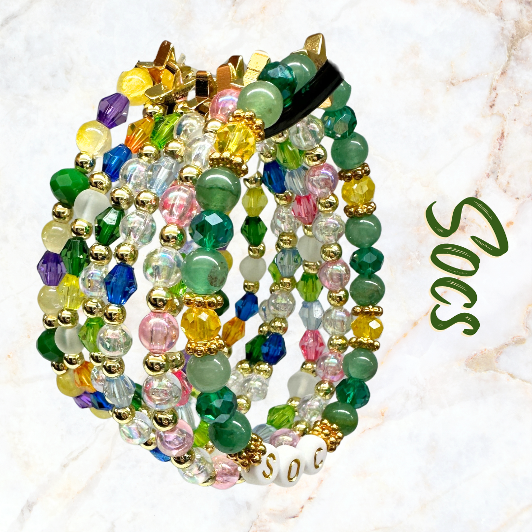 Broadway Stacks STAY GOLD collection. Stretch bracelets included in Stack. Inspired by characters from The Outsiders the Musical. Greasers and Socs. Broadway Stacks gold star logo bead to remind you that You Shine!