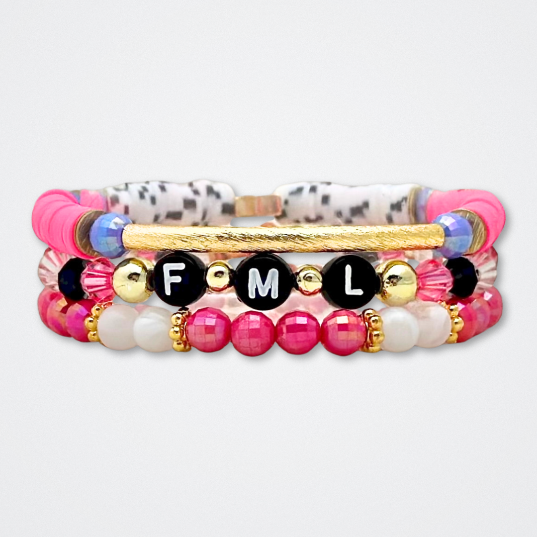 Broadway Stacks POTUS collection. 3 stretch bracelets included in Stack. Pinks, white, blue, golds and black colored beads. Letter beads that spell show quotes. Broadway Stacks gold star logo bead to remind you that You Shine. POTUS play fans.