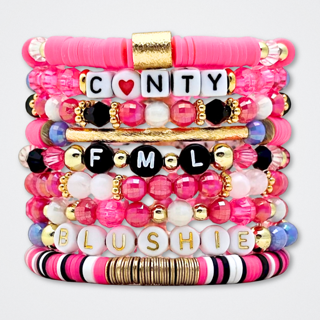 Broadway Stacks POTUS collection. 3 stretch bracelets included in Stack. Pinks, white, blue, golds and black colored beads. Letter beads that spell show quotes. Broadway Stacks gold star logo bead to remind you that You Shine. POTUS play fans.