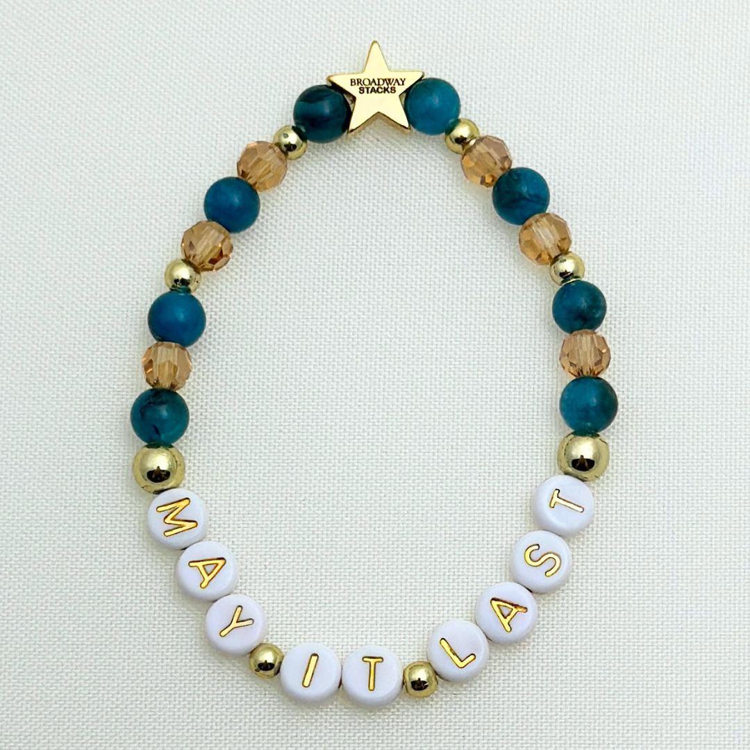 Broadway Stacks SAILOR Collection. 5 stretch bracelets included in Stack. Teal, green, blue and gold colored beads. Letter beads that spell quotes. Gold star logo bead to remind you that you shine.