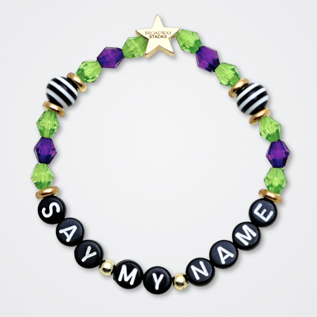 Broadway Stacks NETHERWORLD Collection. 5 stretch bracelets included in Stack. Green, black, purple, striped and gold colored beads. Letter beads that spell quotes. Gold star logo bead to remind you that You Shine. Beetlejuice fans.
