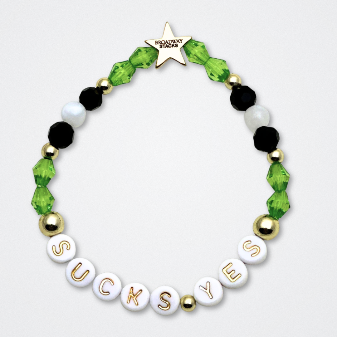 Broadway Stacks NETHERWORLD Collection. 5 stretch bracelets included in Stack. Green, black, purple, striped and gold colored beads. Letter beads that spell quotes. Gold star logo bead to remind you that You Shine. Beetlejuice fans.
