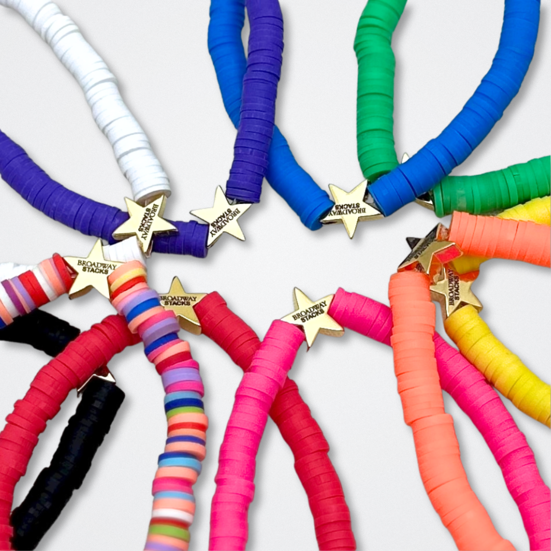 You create your own with CUSTOM text. Broadway Stacks rainbow colors elastic stretch bracelets with gold color accents. Gold star logo bead to remind you that You SHine. Available in red pink orange yellow green blue purple white black and mulit-color.
