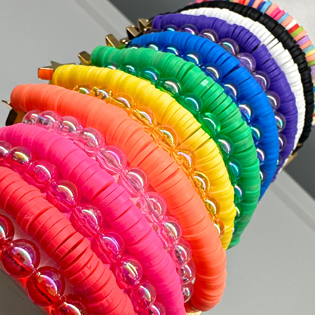 You create your own with CUSTOM text. Broadway Stacks rainbow colors elastic stretch bracelets with gold color accents. Gold star logo bead to remind you that You SHine. Available in red pink orange yellow green blue purple white black and mulit-color.