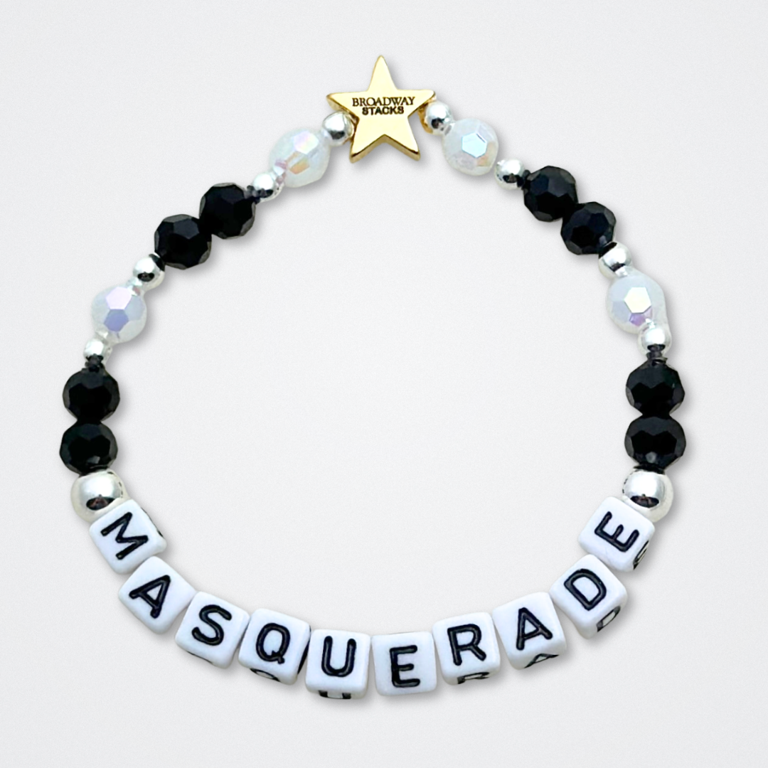 Broadway Stacks MASQUERADE Collection. 4 stretch bracelets included in Stack. Black, white and silver colored beads. Letter beads that spell quotes. Gold star logo bead to remind you that you shine. Phantom of the Opera and Masquerade NYC fans.