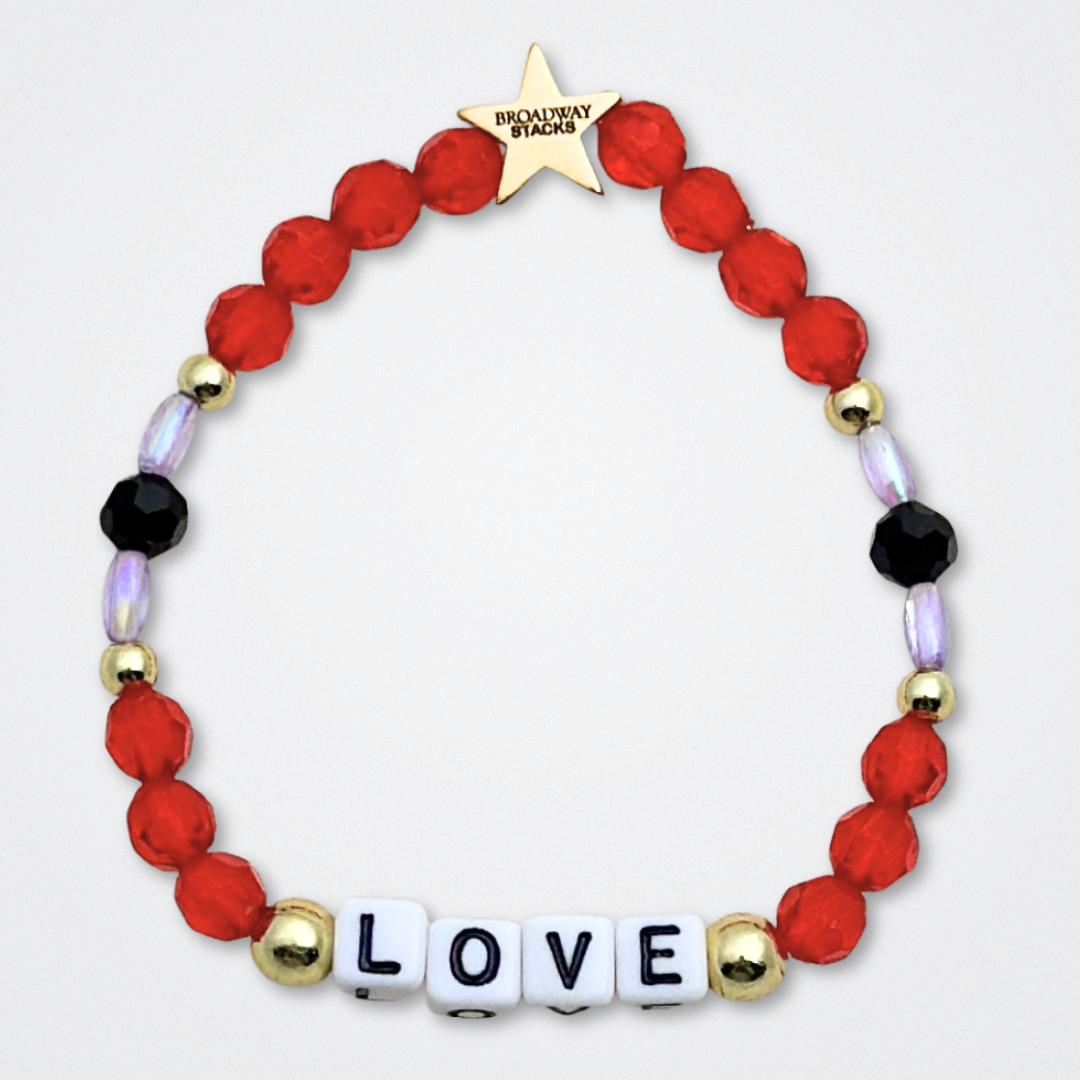 Broadway Stacks RED LIGHT Collection. 5 stretch bracelets included in Stack. Red, purple, black and gold colored beads. Letter beads that spell quotes. Gold star logo bead to remind you that You Shine. Moulin Rouge fans.