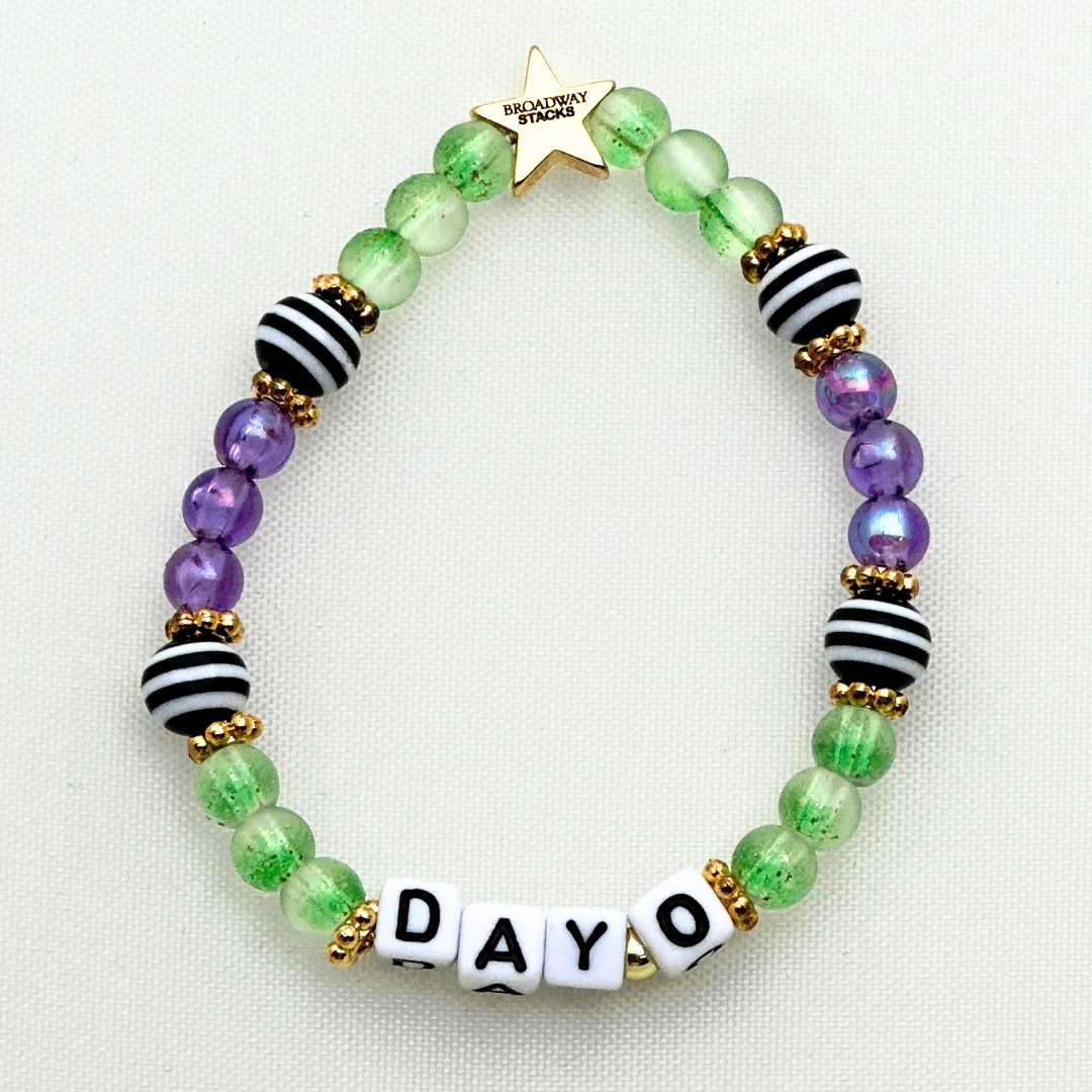 Broadway Stacks NETHERWORLD Collection. 5 stretch bracelets included in Stack. Green, black, purple, striped and gold colored beads. Letter beads that spell quotes. Gold star logo bead to remind you that you shine. Beetlejuice fans.
