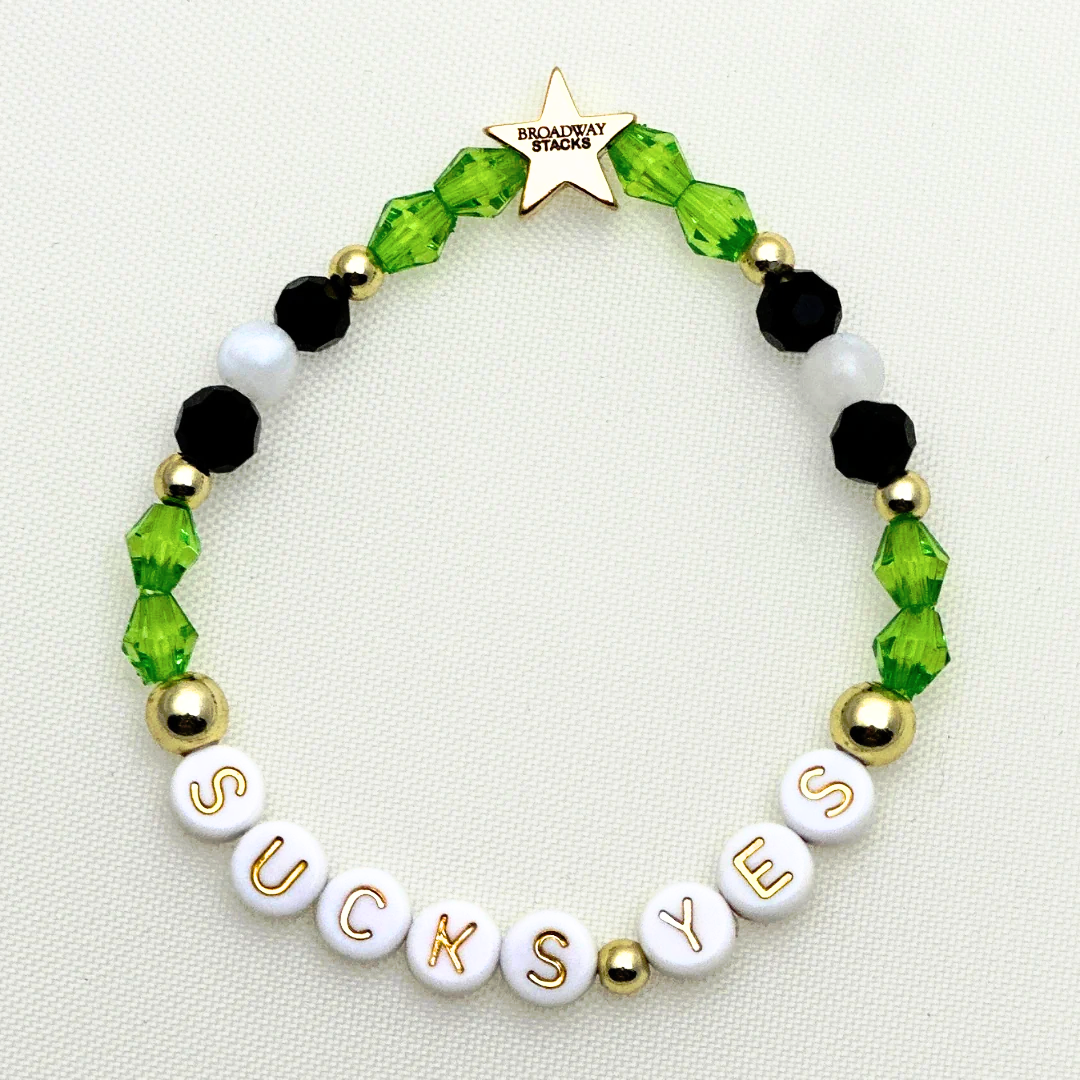 Broadway Stacks NETHERWORLD Collection. 5 stretch bracelets included in Stack. Green, black, purple, striped and gold colored beads. Letter beads that spell quotes. Gold star logo bead to remind you that you shine. Beetlejuice fans.