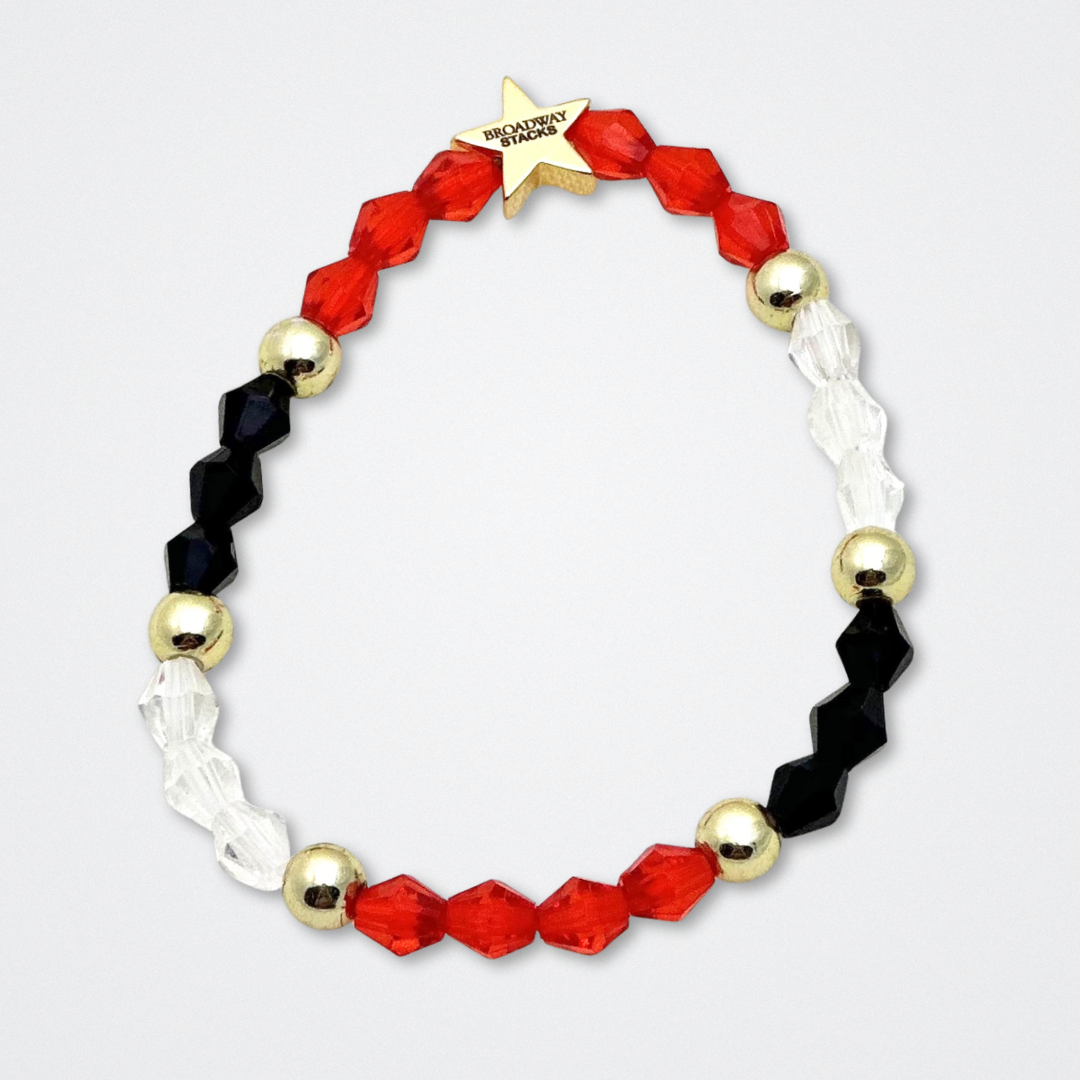 Broadway Stacks MASK collection. Bead bracelets included in Stack. Red, black, white and gold colored beads. Letter beads that spell quotes. Team Phantom, Team Christine, Team Raoul. Gold star logo bead to remind you that You Shine. Phantom of the Opera and Masquerade fans.