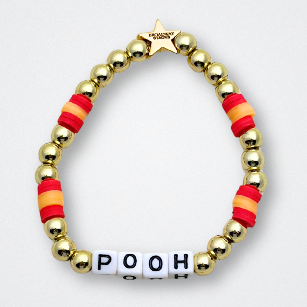 Broadway Stacks HONEY Collection. 3 stretch bracelets included in Stack. Red, yellow and gold colored beads. Letter beads that spell quotes. Gold star logo bead to remind you that You Shine. Winnie the Pooh fans.