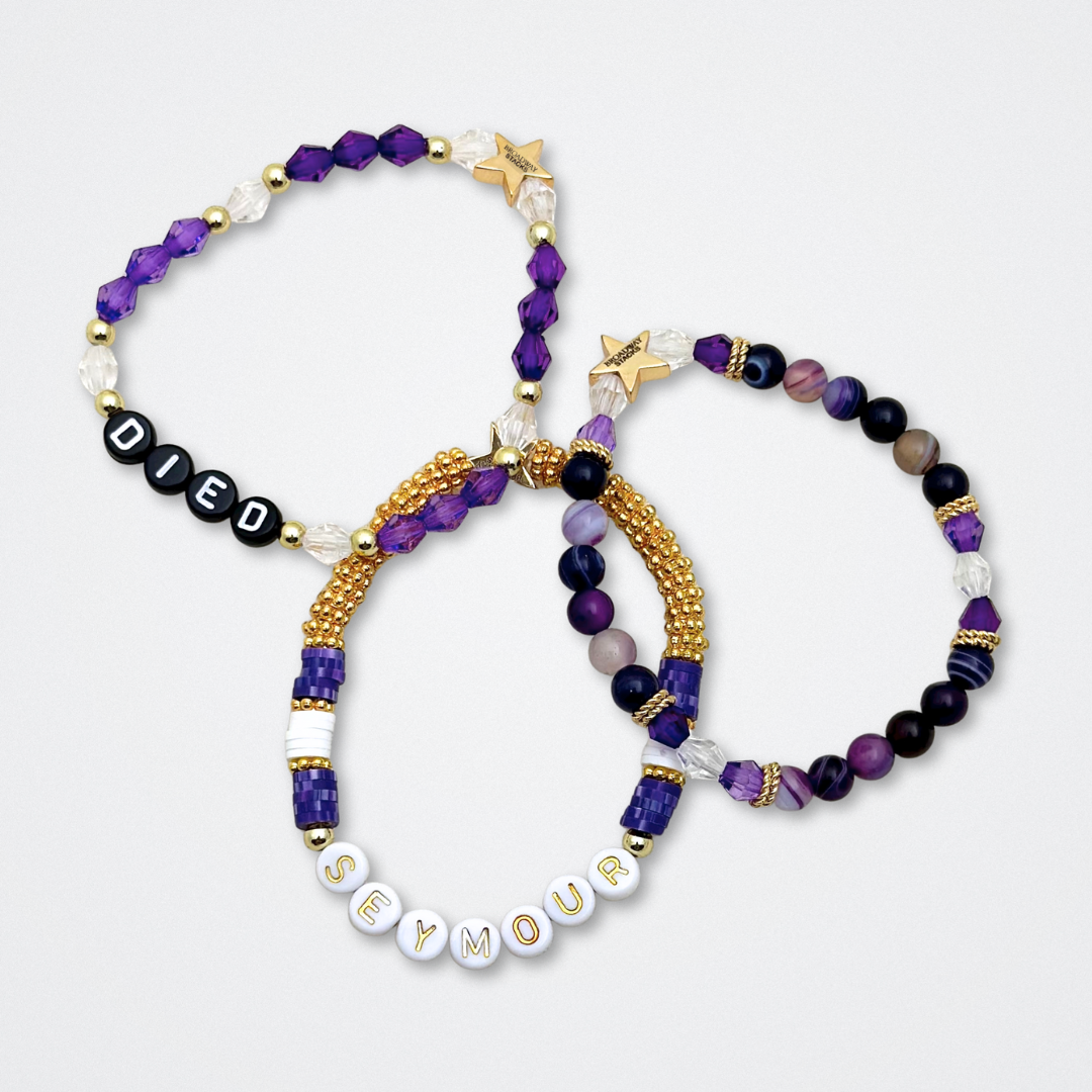 Broadway Stacks QUEEN collection. Stretch bracelets included in Stack. Gold, yellow, green, white, red, pink and blue colored beads. Letter beads that spell each queen. Also Herstory collection. Broadway Stacks gold star logo bead to remind you that You Shine. SIX the Musical fans.