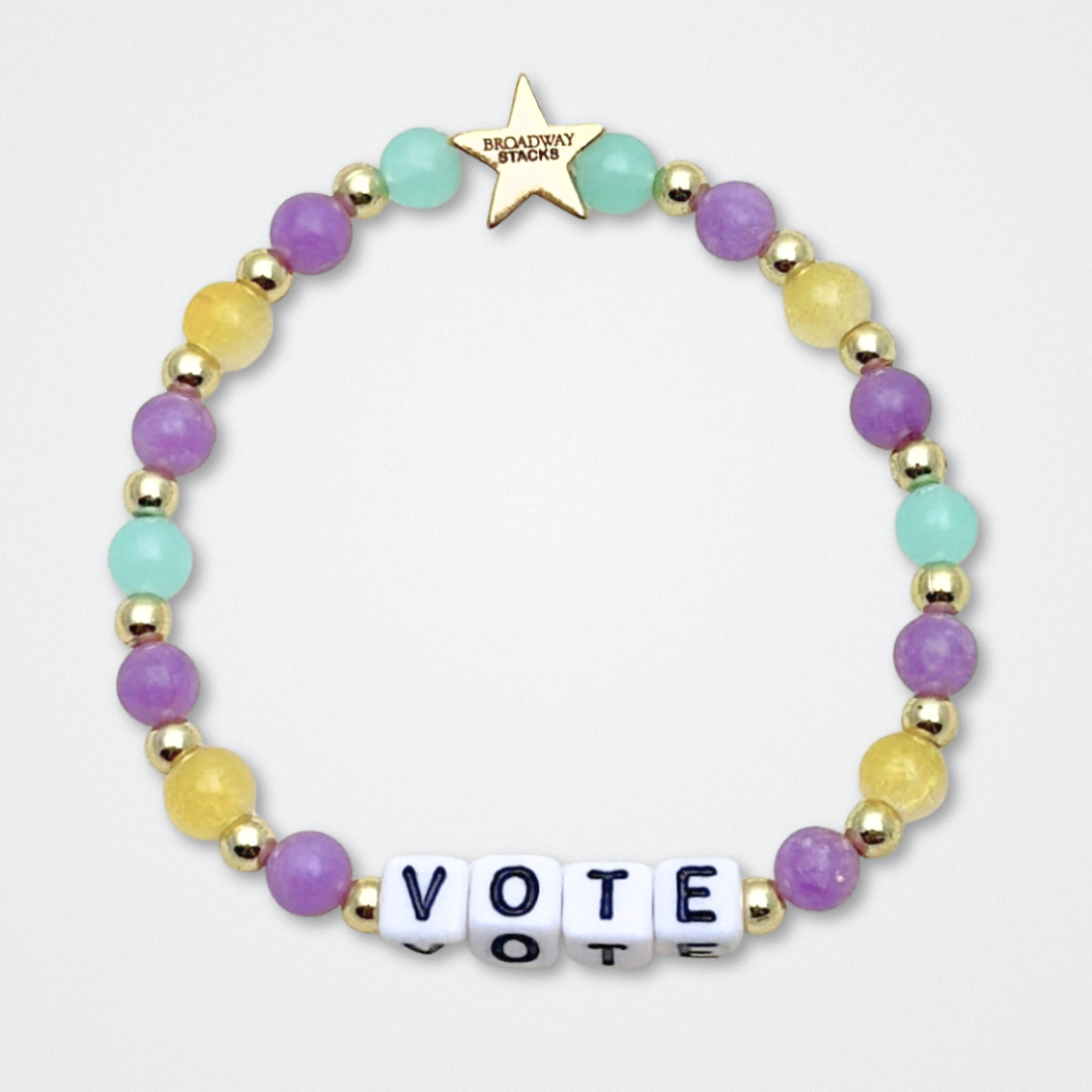 Broadway Stacks CAMPAIGN Collection. 5 stretch bracelets included in Stack. Purple, yellow, teal and gold colored beads. Letter beads that spell quotes. Gold star logo bead to remind you that you shine. Suffs fans.