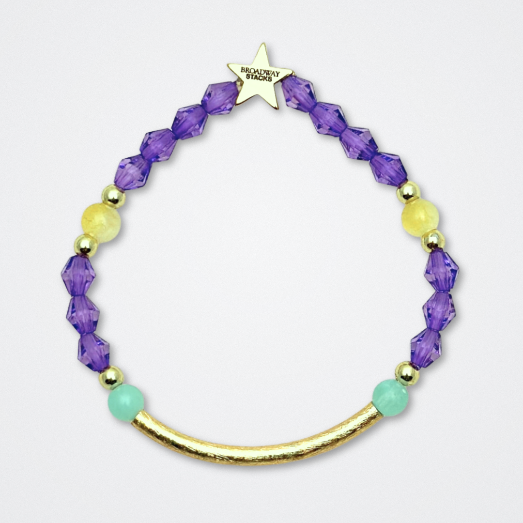 Broadway Stacks CAMPAIGN Collection. 5 stretch bracelets included in Stack. Purple, yellow, teal and gold colored beads. Letter beads that spell quotes. Gold star logo bead to remind you that you shine. Suffs fans.
