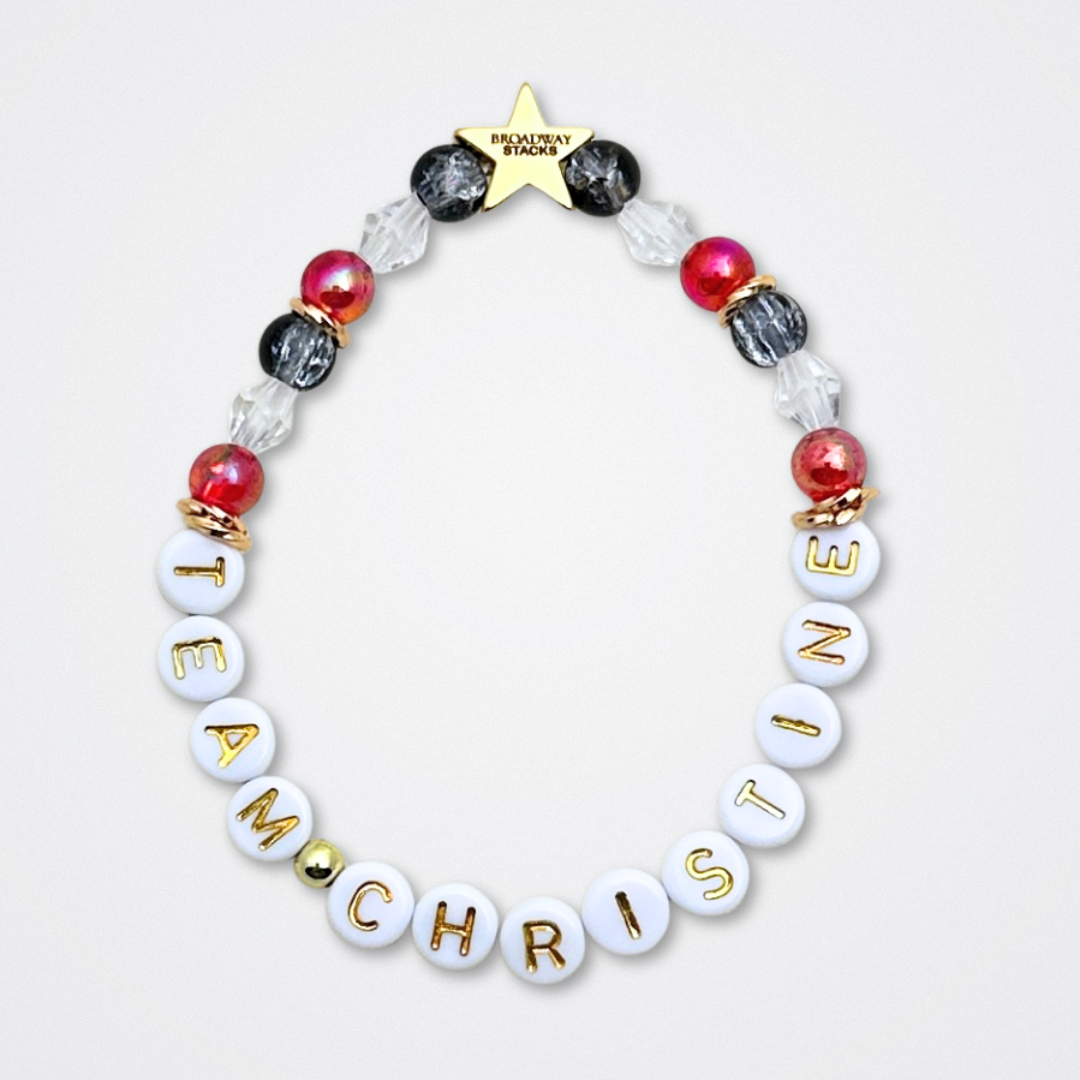 Broadway Stacks MASK collection. Bead bracelets included in Stack. Red, black, white and gold colored beads. Letter beads that spell quotes. Team Phantom, Team Christine, Team Raoul. Gold star logo bead to remind you that You Shine. Phantom of the Opera and Masquerade fans.