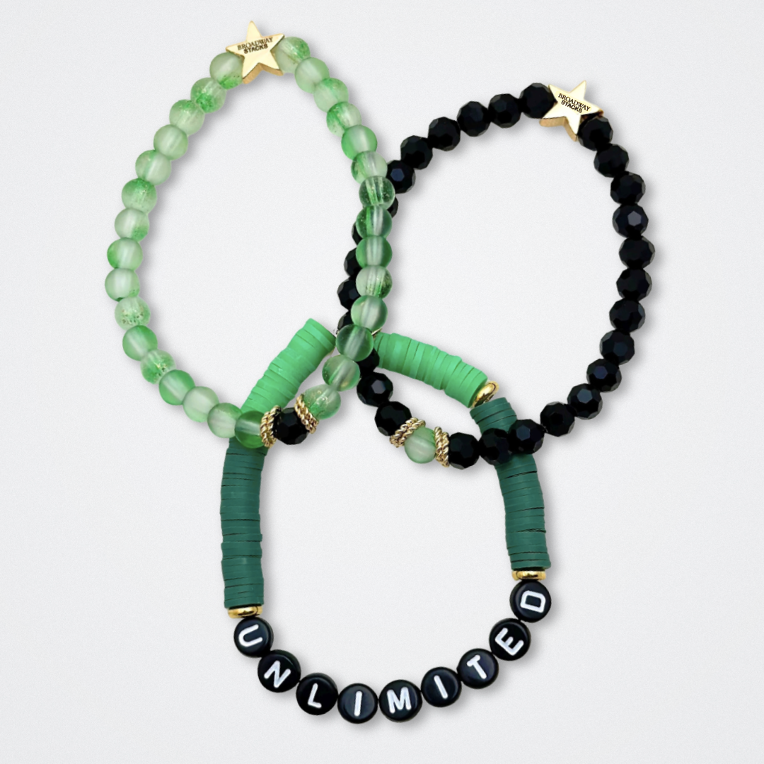 Broadway Stacks WITCH collection. 3 stretch bracelets included in Stack. Greens, pinks, black and gold colored beads. Letter beads that spell quotes. Gold star logo bead to remind you that You Shine. Wicked fans.