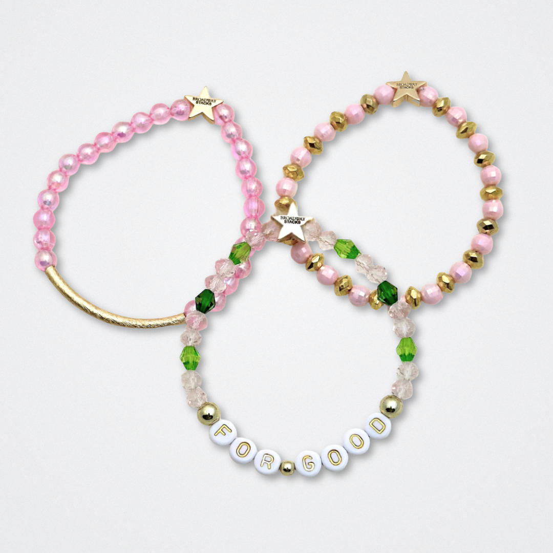 Broadway Stacks WITCH collection. 3 stretch bracelets included in Stack. Greens, pinks, black and gold colored beads. Letter beads that spell quotes. Gold star logo bead to remind you that You Shine. Wicked fans.