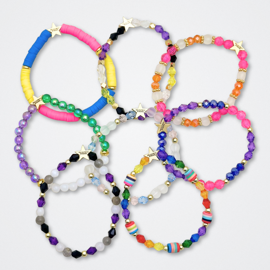 Broadway Stacks PRIDE collection. Available in 8 designs. Rainbow - Red, orange, yellow, green, blue, purple, pink, white, grey, black and gold colored beads. Broadway Stacks gold star logo bead to remind you that You Shine.