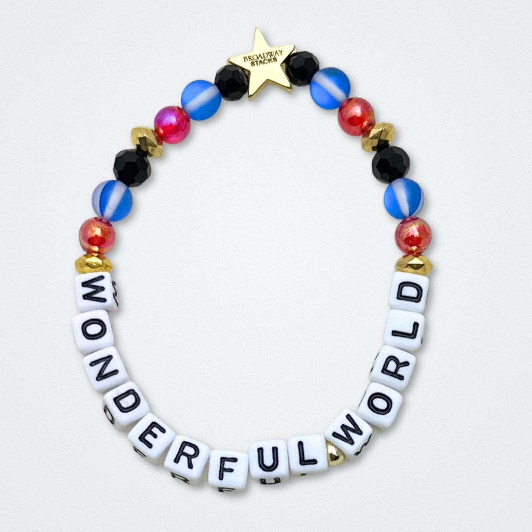 Broadway Stacks JAZZY Collection. 5 stretch bracelets included in Stack. Red, blue, black and gold colored beads. Letter beads that spell quotes. Gold star logo bead to remind you that you shine. Wonderful World musical and Louis Armstrong fans.