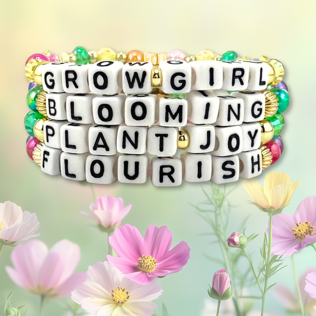 Broadway Stacks GARDEN bead bracelets stacked on floral background. Jewelry says Grow Girl, Blooming, Plant Joy and Flourish.