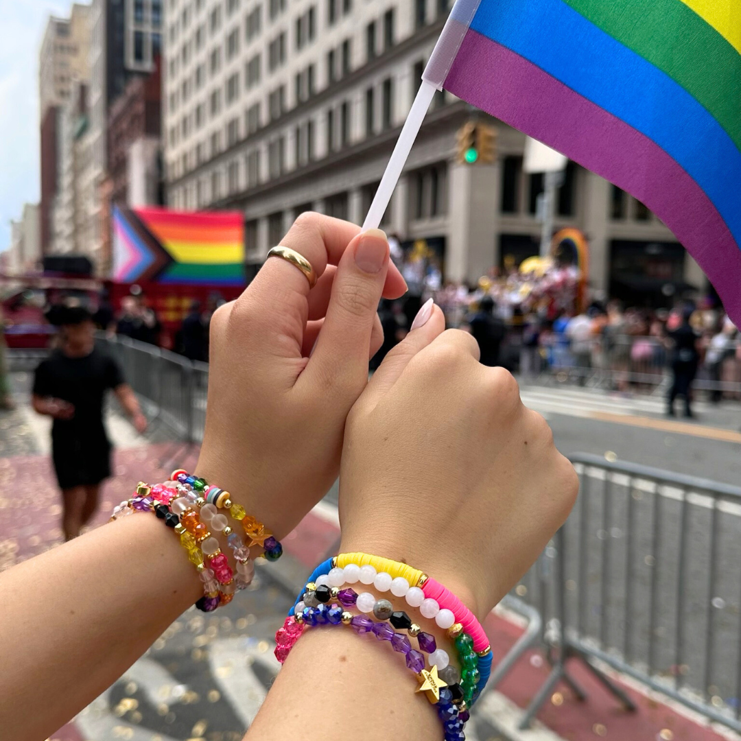 Broadway Stacks PRIDE collection. Available in 8 designs. Rainbow - Red, orange, yellow, green, blue, purple, pink, white, grey, black and gold colored beads. Broadway Stacks gold star logo bead to remind you that You Shine.