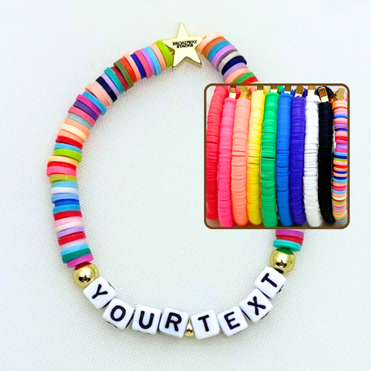 You create your own with CUSTOM text. Broadway Stacks rainbow colors elastic stretch bracelets with gold color accents. Gold star logo bead that says Broadway Stacks. Available in red pink orange yellow green blue purple white black and mulit-color.