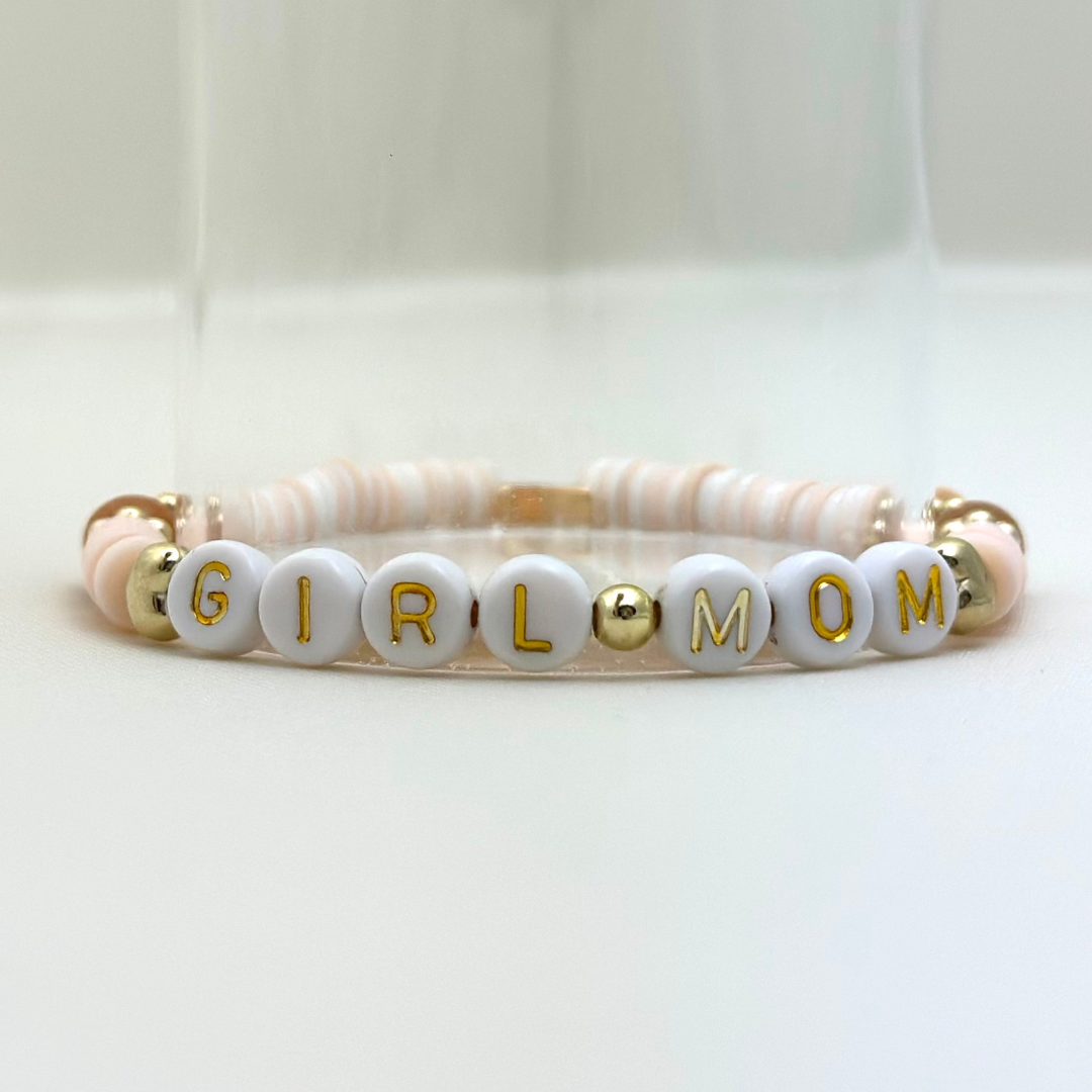 Broadway Stacks Motherlode Special Edition bracelets. Stretch bracelets. Greens, browns, white and gold colored beads. Letter beads that spell Motherlode, Boy Mom, Girl Mom, Twin Mom.