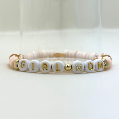 Broadway Stacks Motherlode Special Edition bracelets. Stretch bracelets. Greens, browns, white and gold colored beads. Letter beads that spell Motherlode, Boy Mom, Girl Mom, Twin Mom.