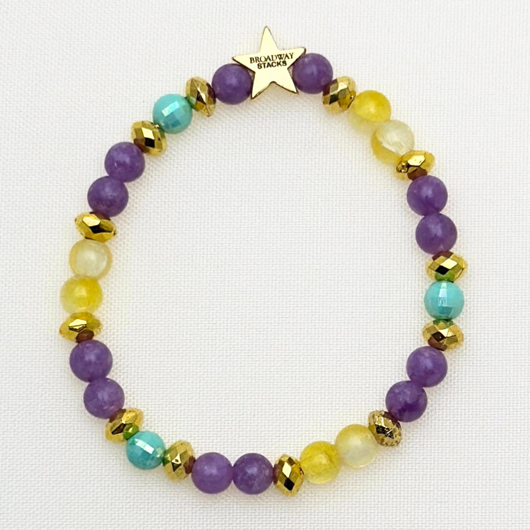 Suffs musical  bead bracelet, purple, yellow, teal and gold beads, gold star logo bead of Broadway Stacks