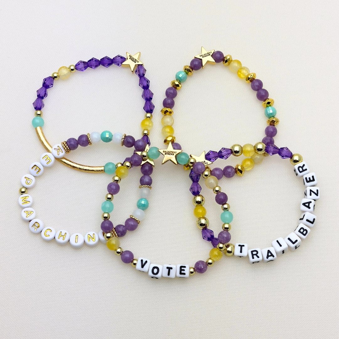 Suffs musical bead bracelets, purple, yellow, teal and gold beads, gold star logo bead of Broadway Stacks