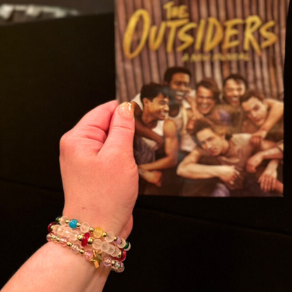 Broadway Stacks STAY GOLD collection. Stretch bracelets included in Stack. Inspired by characters from The Outsiders. Broadway Stacks gold star logo bead on back.
