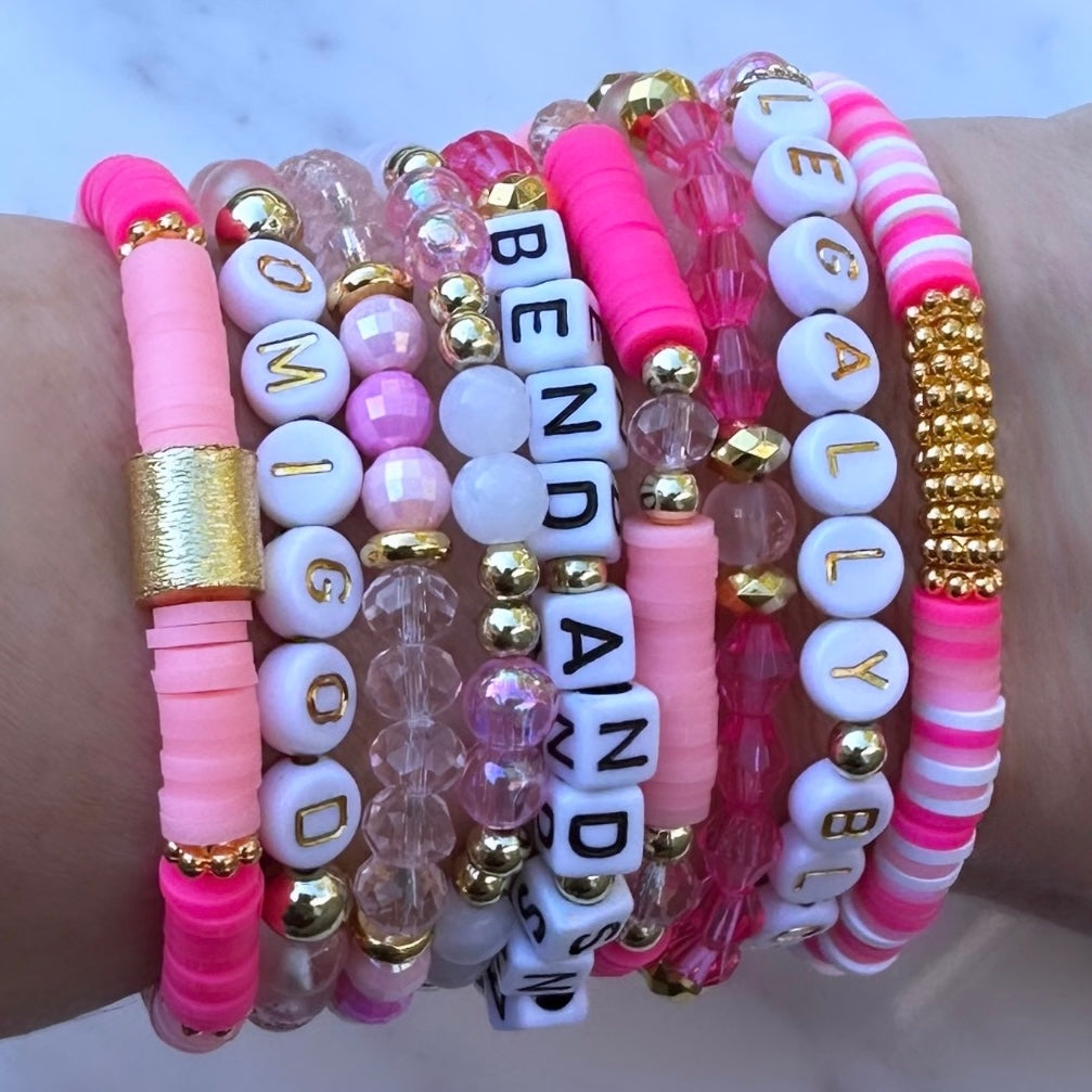 Broadway Stacks Legally Blonde collection. 3 stretch bracelets included in Stack. Pinks, white and gold colored beads. Letter beads that spell Legally Blonde.