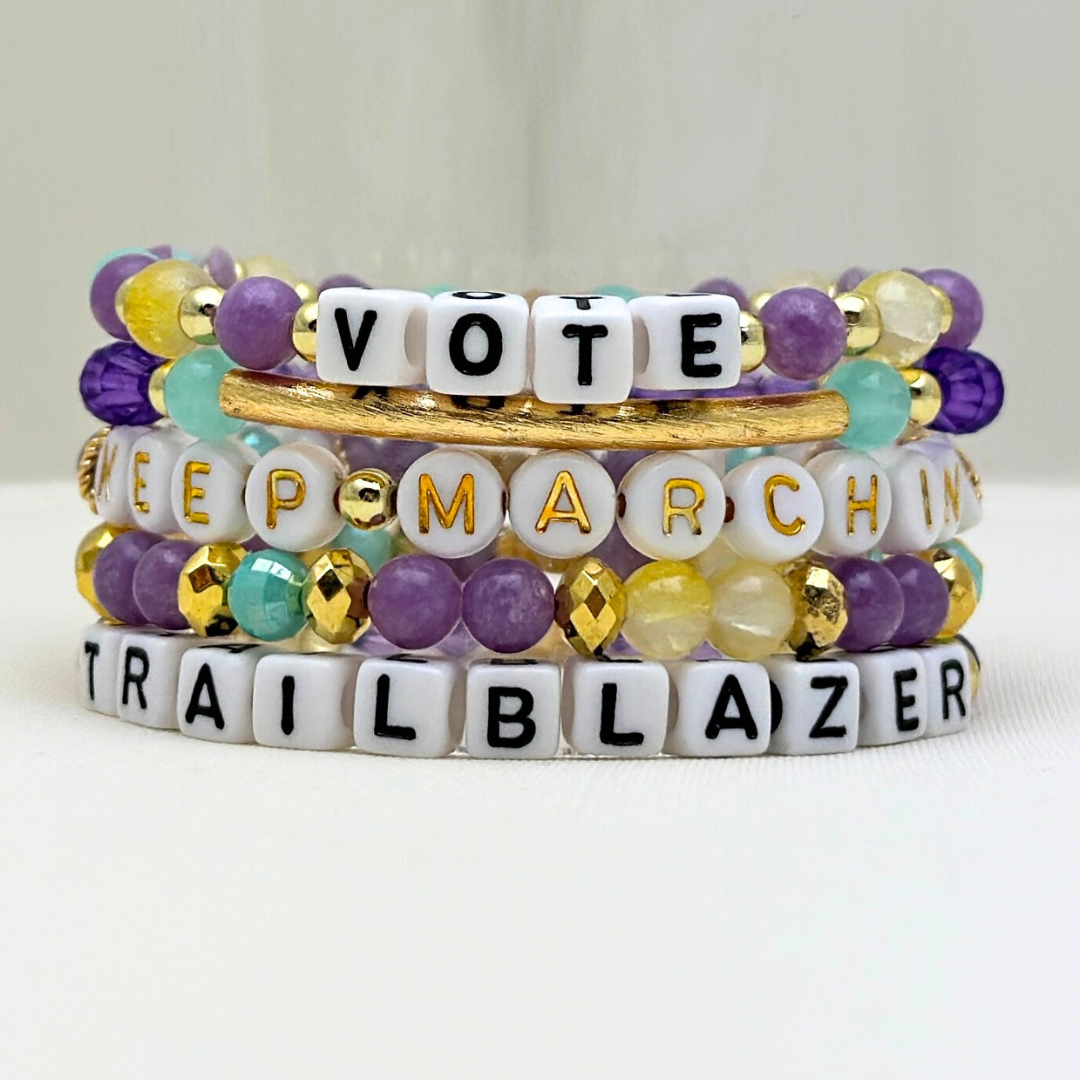 Suffs musical bead bracelets, purple, yellow, teal and gold beads, gold star logo bead of Broadway Stacks