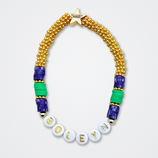 Broadway Stacks QUEEN collection. Stretch bracelets included in Stack. Gold, yellow, green, white, red, pink and blue colored beads. Letter beads that spell each queen. Also Herstory collection. Broadway Stacks gold star logo bead to remind you that You Shine. SIX the Musical fans.